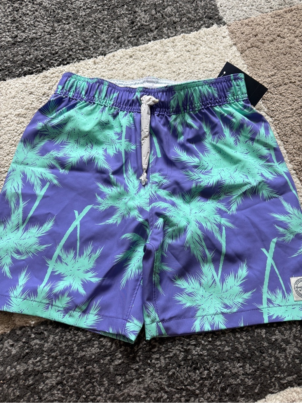 Abercrombie Kids Core Swim Shorts in Purple and Teal Palm Print- 11/12